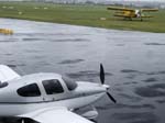 145.Archerfield Airport, Brisband, OZ (YBAF)...a soggy SR-22-G3 Turbo & Antonov An-2