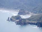 274.Taitomo Island, Lion Rock & Piha Beach, NZ (W of Auckland, looking NE)